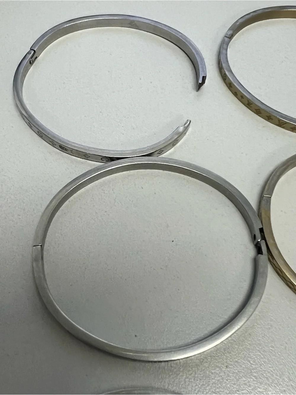 Chanel, LV, Gucci Stackable Silver and Gold Logo Bangle Set - Picture 14 of 16